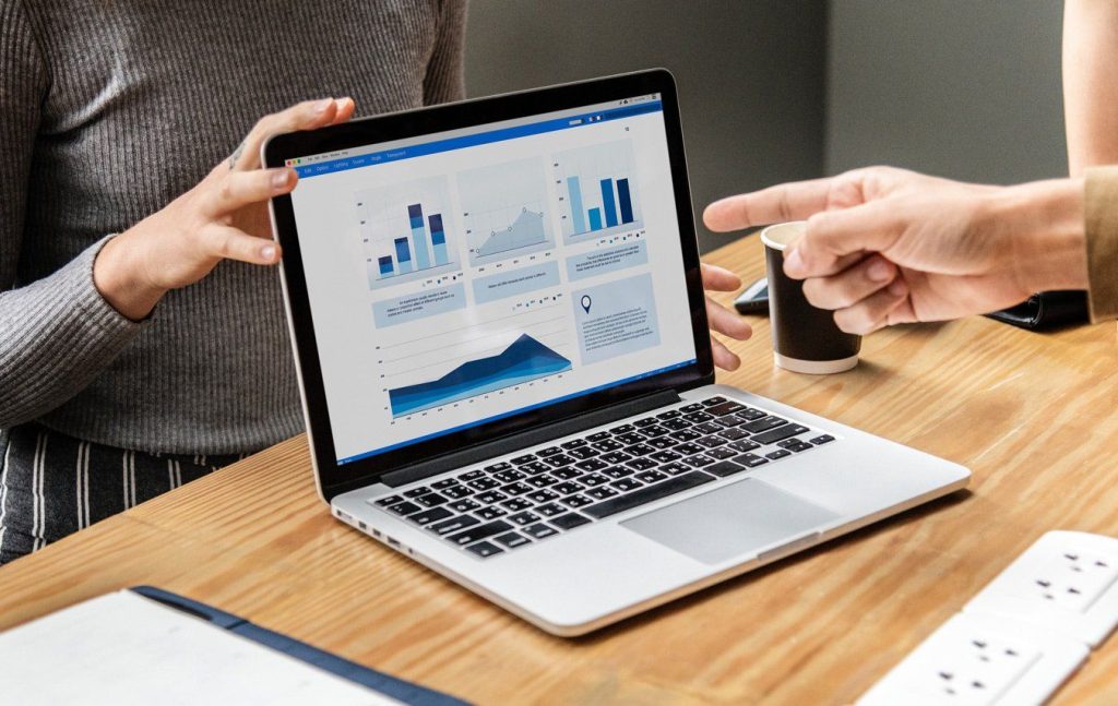 laptop displaying financial charts